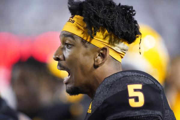 Arizona State quarterback Jayden Daniels (5) looks on from the sidelines in the second half during an NCAA college football game against BYU Saturday, Sept. 18, 2021, in Provo, Utah. (AP Photo/Rick Bowmer)