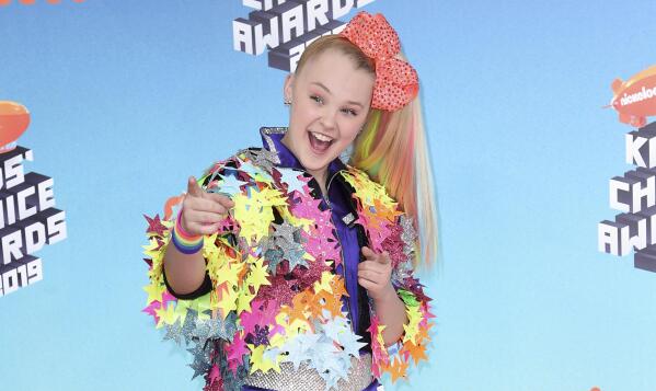 FILE - JoJo Siwa arrives at the Nickelodeon Kids' Choice Awards on March 23, 2019, In Los Angeles. Siwa will compete as part of the first same-sex pairing on "Dancing With the Stars" for the show's upcoming 30th season. (Photo by Richard Shotwell/Invision/AP, File)