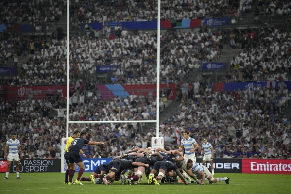 Players contest a scrum during the Rugby World Cup Pool D match between England and Argentina in the Stade de Marseille, Marseille, France Saturday, Sept. 9, 2023. (AP Photo/Daniel Cole)