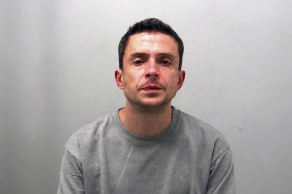 This undated photo issued by Essex Police on Tuesday March 19, 2024 shows Nicholas Hawkes, 39, a convicted sex offender who sent unsolicited photos of his genitals to a girl and a woman, was the first person in England and Wales convicted of violating the Online Safety Act. England's first convicted cyber-flasher was sentenced Tuesday to 5 1/2 years in prison. (Essex Police via AP)