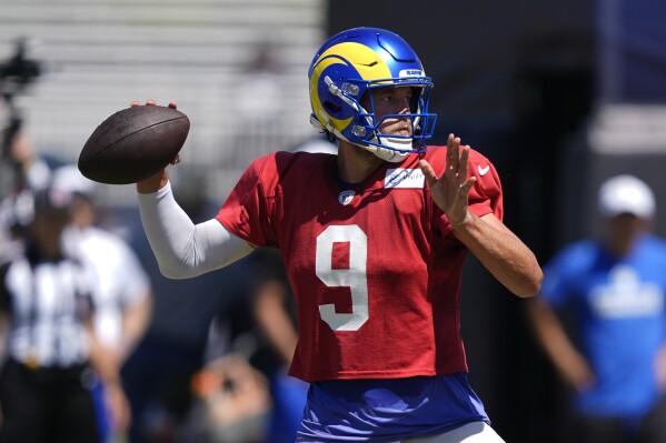 Los Angeles Rams quarterback Matthew Stafford throws during a joint NFL football practice with the Dallas Cowboys, Wednesday, Aug. 14, 2024, in Oxnard, Calif. (AP Photo/Ryan Sun)