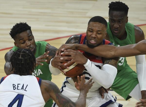 United States' Damian Lillard (6) defends the ball against Nigeria during an exhibition basketball game Saturday, July 10, 2021, in Las Vegas. (AP Photo/David Becker)
