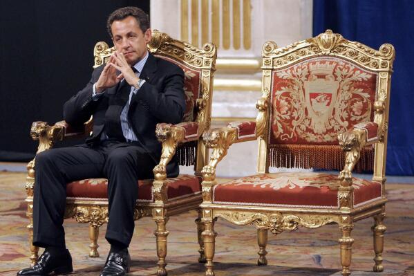 FILE - In this Thursday, May, 24, 2007 file picture, French President Nicolas Sarkozy sits during an official and traditional ceremony with Paris mayor Bertrand Delanoe, whose empty chair is at right, during which the newly elected President is met by the Paris mayor at the Paris city hall, France. The trial of former French President Nicolas Sarkozy concludes Tuesday in Paris, after a month during which the court sought to determine whether he broke laws on campaign financing in his unsuccessful 2012 re-election bid (AP Photo/Christophe Ena, File)