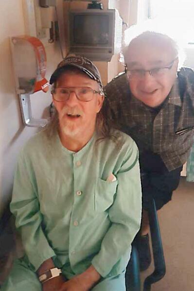 This photo provided by Gary Nichols shows him, right, with his brother, Alan, on the eve of his euthanization in Chilliwack, British Columbia, Canada, in July 2019. Alan submitted a request to be euthanized and he was killed, despite concerns raised by his family and a nurse practitioner. Nichols’ family reported the case to police and health authorities, arguing that he lacked the capacity to understand the process and was not suffering unbearably — among the requirements for euthanasia. “Alan was basically put to death,” his brother, Gary, says. (Courtesy Gary Nichols via AP)