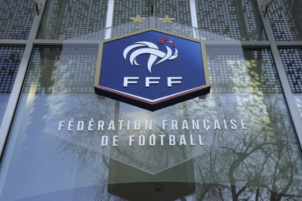 FILE - The logo of the French soccer federation (FFF), is pictured at the federation headquarters, Wednesday, Jan. 11, 2023 in Paris. France’s highest administrative jurisdiction said Thursday, June 29, 2023 the country's soccer federation is entitled to ban headscarves in matches. (AP Photo/Michel Euler, File)