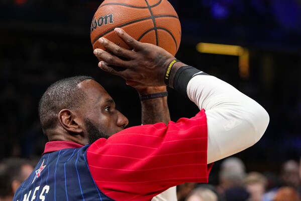 Los Angeles Lakers forward LeBron James (23) warms up before the start of the NBA All-Star basketball game in Indianapolis, Sunday, Feb. 18, 2024. (APPhoto/Darron Cummings)