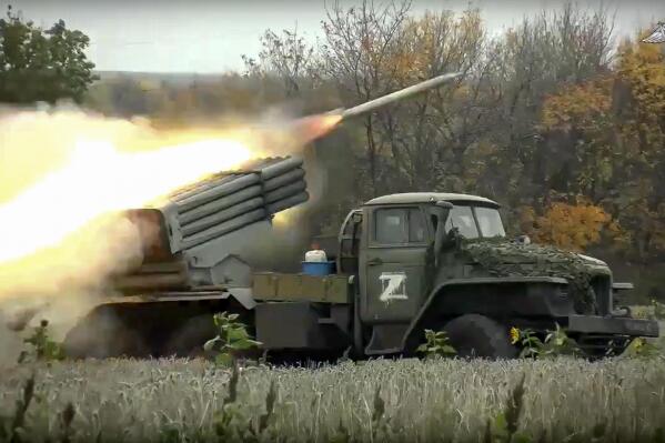 FILE - This handout photo taken from video released by Russian Defense Ministry Press Service on Oct. 4, 2022, shows a Grad multiple rocket launcher firing at Ukrainian troops at an undisclosed location. (Russian Defense Ministry Press Service photo via AP, File)