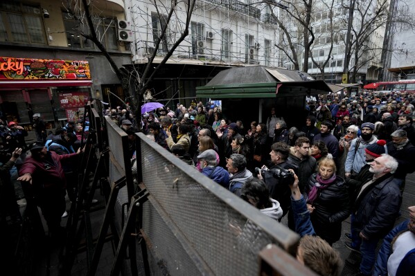 Demonstrators protest outside the Buenos Aires City Legislature against an event organized by Victoria Villarruel, the running mate of Freedom Advances party presidential candidate Javier Milei, to honor the 1970´s victims of armed leftist groups. (AP Photo/Natacha Pisarenko)