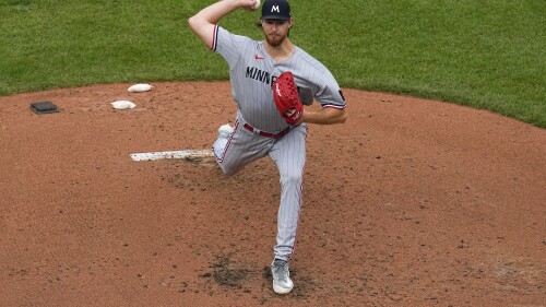 Minnesota Twins starting pitcher Bailey Ober throws a pitch to the Baltimore Orioles during the fourth inning of a baseball game, Saturday, July 1, 2023, in Baltimore. (AP Photo/Julio Cortez)
