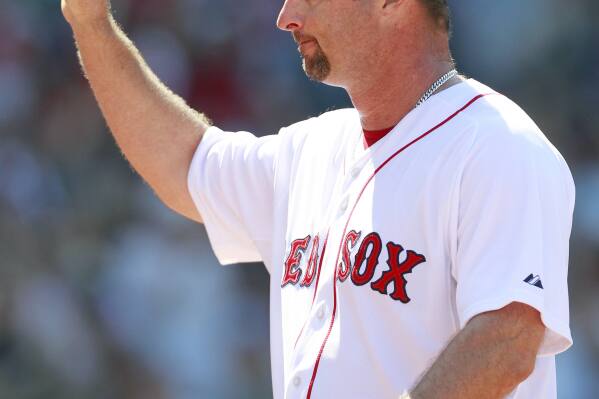 FILE - Boston Red Sox's Tim Wakefield tips his cap as he comes off the field in the sixth inning of a baseball game against the Seattle Mariners in Boston, July 24, 2011. Wakefield, the knuckleballing workhorse of the Red Sox pitching staff who bounced back after giving up a season-ending home run to the Yankees in the 2003 playoffs to help Boston win its curse-busting World Series title the following year, has died. He was 57. The Red Sox announced his death in a statement Sunday, Oct. 1 2023, (AP Photo/Michael Dwyer, file)