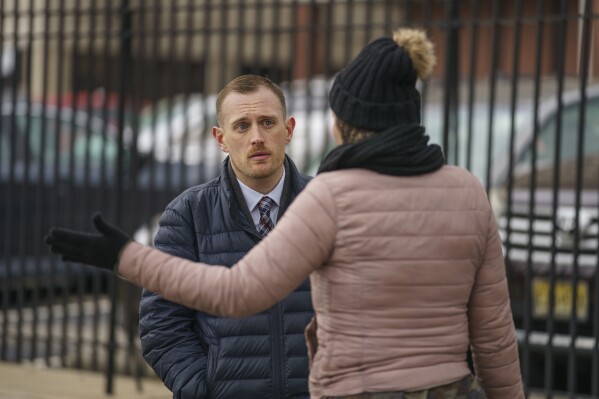 Josh Kruger, left, then the Communications Director, the Office of Homeless Services at City of Philadelphia, at a tent encampment in Philadelphia, on Jan. 6, 2020. The journalist and advocate who rose from homelessness and addiction to serve as a spokesperson for Philadelphia's most vulnerable was shot and killed at his home early Monday, Oct. 2, 2023 police said. (Jessica Griffin/The Philadelphia Inquirer via AP)