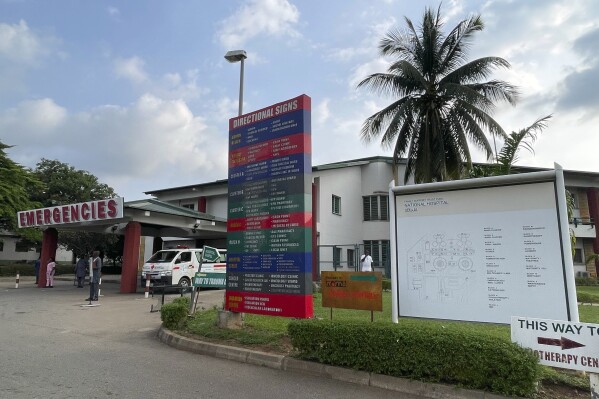 FILE - An ambulance is parked at the emergency unit of the National hospital in Abuja Nigeria, Wednesday, July. 26, 2023. Striking Nigerian doctors on Saturday, Aug. 5, 2023, said they will embark on a nationwide protest, accusing the country’s newly elected president of ignoring their demands for better pay, better work conditions and payment of owed earnings. (AP Photo/Chinedu Asadu, File)