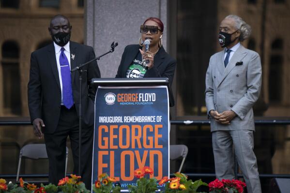 George Floyd's sister, Bridgett Floyd, addresses a rally in downtown Minneapolis, Sunday, May 23, 2021. At left is attorney Ben Crump. At right is the Rev. Al Sharpton. “It has been a long year. It has been a painful year,” Floyd's sister Bridgett told the crowd on Sunday.(Jeff Wheeler/Star Tribune via AP)
