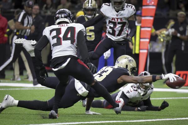 New Orleans Saints tight end Juwan Johnson (83) stretches out for a touchdown against the Atlanta Falcons during an NFL football game in New Orleans on Sunday, Dec 18, 2022. (Brett Duke/The Times-Picayune/The New Orleans Advocate via AP)