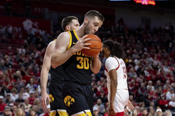Iowa's Connor McCaffery (30) reacts to a foul call against him in the first half during an NCAA college basketball game against Nebraska, Thursday, Dec. 29, 2022, in Lincoln, Neb. (AP Photo/John Peterson)