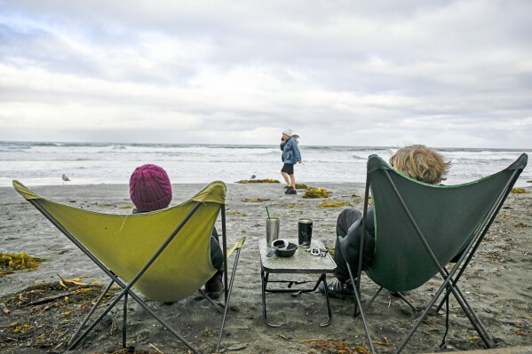 FILE - Elke Lindner left and Elke Lindner watch the surf at La Jolla Shore Jan 23 2024 in La Jolla Calif For the eighth straight month Earth was record hot according to the European climate agencys analysis of January 2024 AP PhotoDenis Poroy File