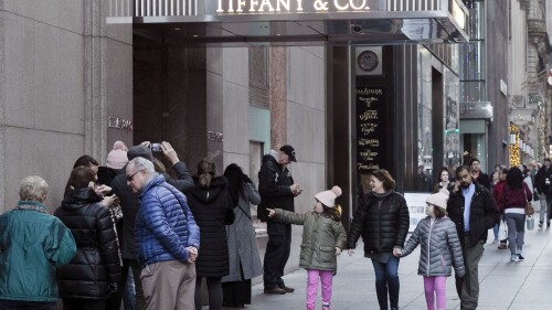 FILE - People walk by Tiffany's flagship store in New York, Nov. 25, 2019. A fire broke out Thursday, June 29, 2023, in the basement of the flagship Tiffany & Co. store on New York's Fifth Avenue, officials said. (AP Photo/Mark Lennihan, File)