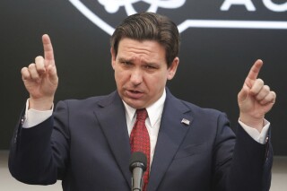 FILE - Florida Gov. Ron DeSantis delivers remarks at NeoCity Academy in Kissimmee, Fla., Jan. 26, 2024. Less than two weeks after suspending his presidential campaign, DeSantis finally weighed on what he wants lawmakers to do this year: Change Washington. Today, Monday, Jan. 29, 2023, is the start of the fourth week of a legislative session that lasts less than nine weeks. (Joe Burbank /Orlando Sentinel via AP, File)