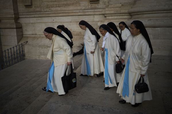 Nuns leave after entering the St. Peter's Basilica to pay their respects to Pope Francis lying in state, at the Vatican, Thursday, April 24, 2025. (AP Photo/Emilio Morenatti)