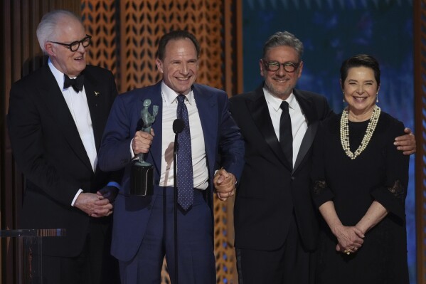 John Lithgow, Ralph Fiennes, Sergio Castellitto, and Isabella Rossellini accept the SAG Ensemble Award for Conclave