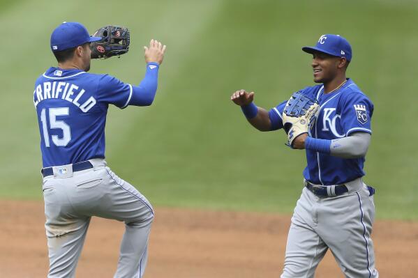 Kansas City Royals' Whit Merrifield (15) celebrates with teammate Edward Olivares after their win over the Minnesota Twins during a baseball game Sunday, May 30, 2021, in Minneapolis. (AP Photo/Stacy Bengs)