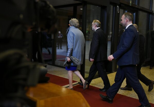 
              British Prime Minister Theresa May, left, leaves with her delegation at the conclusion of an EU summit in Brussels, Thursday, April 11, 2019. European Union leaders on Thursday offered Britain an extension to Brexit that would allow the country to delay its EU departure date until Oct. 31. (AP Photo/Riccardo Pareggiani)
            