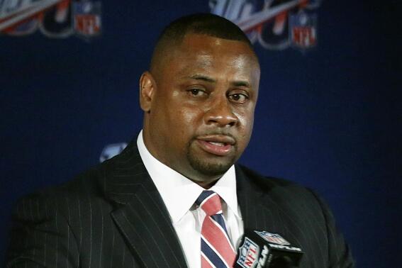 FILE - In this May 22, 2019, file photo, Troy Vincent, NFL executive vice president of football operations, speaks to the media during the owners meetings in Key Biscayne, Fla. Flag football will be played at an international, multi-sport event for the first time next week during the World Games in Birmingham, Alabama.  The NFL may be the sport’s biggest cheerleader. “When we talk about the future of the game of football, it is, no question, flag,” NFL executive Troy Vincent told The Associated Press. (AP Photo/Brynn Anderson, File)