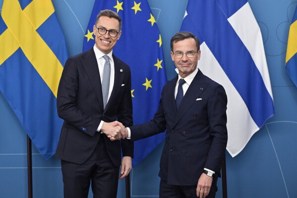 President of Finland Alexander Stubb, left, is received by Sweden's Prime Minister Ulf Kristersson at the government headquarters Rosenbad in Stockholm, on the occasion of Stubb's two-day visit to Sweden, Tuesday, April 23, 2024. (Henrik Montgomery/TT News Agency via AP)