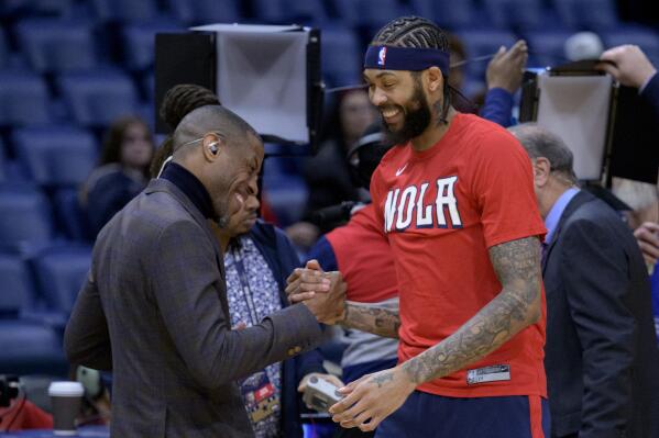 New Orleans Pelicans forward Brandon Ingram, right, greets Pelicans broadcast color analyst Antonio Daniels, a former player, before the team's NBA basketball game against the Minnesota Timberwolves in New Orleans, Wednesday, Jan. 25, 2023. (AP Photo/Matthew Hinton)