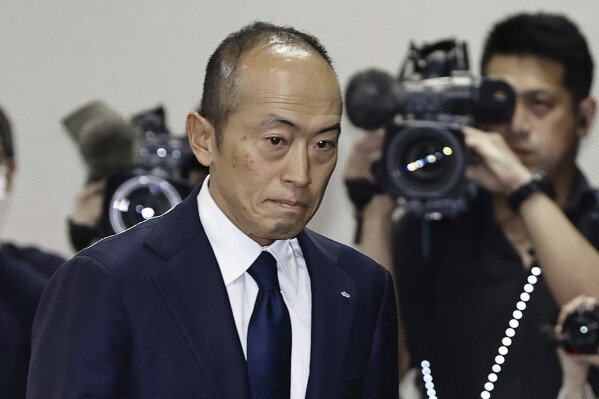 Akihiro Kobayashi, president of Kobayashi Pharmaceutical Co., arrives at a news conference in Osaka, western Japan, Friday, March 29, 2024. In the week since a line of Japanese health supplements began being recalled, several people have died and more than 100 people were hospitalized as of Friday. The Osaka-based pharmaceutical company came under fire for not going public quickly with problems known internally as early as January. The first public announcement came March 22. (Yohei Fukuyama/Kyodo News via AP)