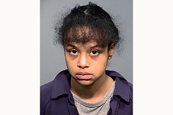 FILE - This undated booking photo provided by the Flagstaff Police Department shows Elizabeth Archibeque. Archibeque, who has pleaded guilty to murder and child abuse, is scheduled to be sentenced Thursday, July 27, 2023, for the starvation death of her 6-year-old son, who had been locked in a closet at their Flagstaff apartment and denied food. (Flagstaff Police Department via AP, File)