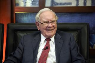 FILE - Berkshire Hathaway Chairman and CEO Warren Buffett smiles during an interview in Omaha, Neb., May 7, 2018. Buffett recommitted to his favorite bank stock, Bank of America, during the first quarter while dumping two other banks as part of a number of moves in Berkshire Hathaway's stock portfolio. Berkshire provided a quarterly update on its U.S. holdings Monday, May 15, 2023, in a filing with the Securities and Exchange Commission. (AP Photo/Nati Harnik, File)