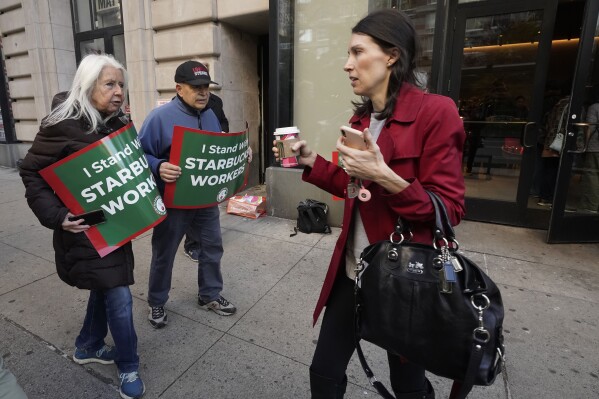 Thousands of Starbucks workers strike on Red Cup Day : NPR