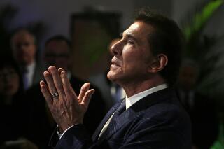 FILE - Former Las Vegas casino mogul Steve Wynn gestures at a news conference in Medford, Mass., March 15, 2016. An effort by Nevada casino regulators to impose a $500,000 fine and discipline former Las Vegas casino mogul Wynn over allegations of workplace sexual misconduct had new life Friday, April 1, 2022, after a state Supreme Court decision in a jurisdictional question. Wynn denies all allegations against him. (AP Photo/Charles Krupa, File)