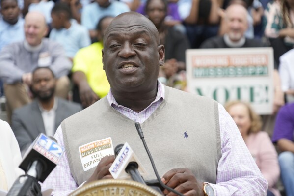 Pastor Gregory Divinity, of New Vineyard Church in Jackson, Miss., leads a call for "full" Medicaid expansion, at a rally on the south steps of the Mississippi State Capitol in Jackson, Tuesday, April 16, 2024. A gathering of over 200 people representing religious organizations, social and human service organizations and legislators gathered at the Capitol and called for "full" Medicaid expansion rather than an alternative proposal that would cover fewer people. (AP Photo/Rogelio V. Solis)