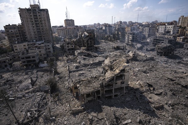 FILE - A view of the debris of buildings hit by Israeli air strikes in Gaza City on October 10, 2023.  After an 11-week war in Gaza, the Israeli military campaign against Hamas is now one of the deadliest and most destructive in history.  ,  The Palestinian death toll is approaching 20,000 and satellite data shows a third of the structures in the small area have been destroyed.  (AP Photo/Fatima Shabair, File)