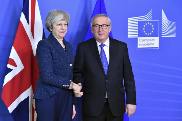 
              European Commission President Jean-Claude Juncker shakes hands with British Prime Minister Theresa May before their meeting at the European Commission headquarters in Brussels, Thursday, Feb. 7, 2019. (AP Photo/Geert Vanden Wijngaert)
            