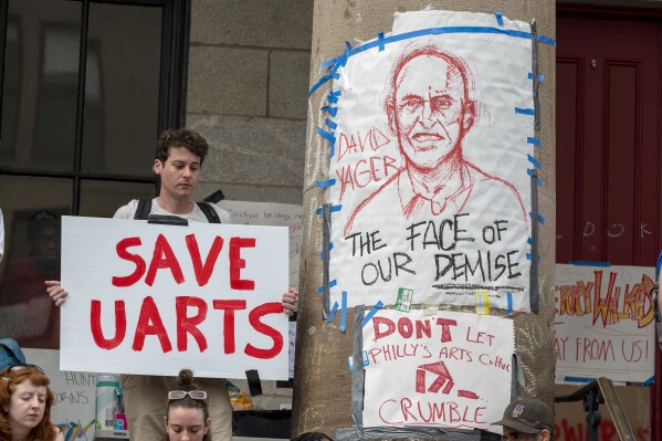 A drawing of David Yager, former president of University of the Arts, is on a column outside Hamilton Hall on their campus in Philadelphia, Wednesday June 5, 2024 as students, staff, and faculty rally before marching to 1500 Market and another rally in front of the former law offices of UArts chair Jud Aaron. (Tom Gralish/The Philadelphia Inquirer via AP)