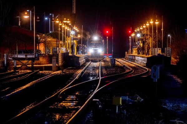 A regional train picks up passengers at the station in Wehrheim near Frankfurt, Germany, Monday, Jan. 22, 2024. German GDL union announced a six-day long strike of the train drivers from Wednesday on. (AP Photo/Michael Probst)