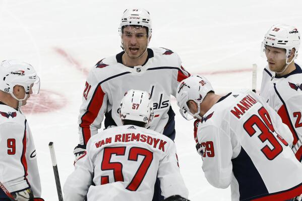Washington Capitals' Garnet Hathaway (21) reacts after scoring during the second period of an NHL hockey game against the Boston Bruins, Saturday, Feb. 11, 2023, in Boston. (AP Photo/Michael Dwyer)