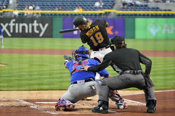 Pittsburgh Pirates' Colin Moran (19) hits a three-run home run off Chicago Cubs starting pitcher Alec Mills in the first inning of a baseball game in Pittsburgh, Tuesday, Sept. 28, 2021. (AP Photo/Gene J. Puskar)