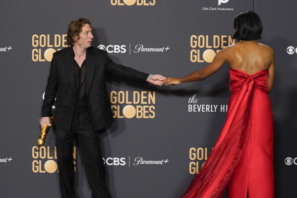 Jeremy Allen White, left, winner of the award for best performance by an actor in a television series, musical or comedy for "The Bear," and Ayo Edebiri, winner of for best performance by an actress in a television series, musical or comedy for "The Bear", pose in the press room at the 81st Golden Globe Awards on Sunday, Jan. 7, 2024, at the Beverly Hilton in Beverly Hills, Calif. (AP Photo/Chris Pizzello)