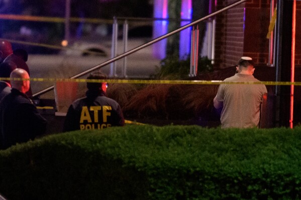 Law enforcement work the scene after two staff members of the Israeli Embassy in Washington were shot and killed outside the Capital Jewish Museum, Thursday, May 22, 2025, in Washington.. (AP Photo/Rod Lamkey, Jr.)