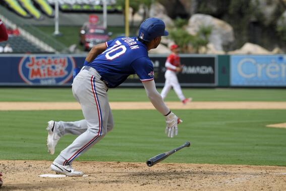 Texas Rangers' Ezequiel Duran runs to first as he hits a three RBI double during the ninth inning of a baseball game against the Los Angeles Angels Sunday, July 31, 2022, in Anaheim, Calif. (AP Photo/Mark J. Terrill)