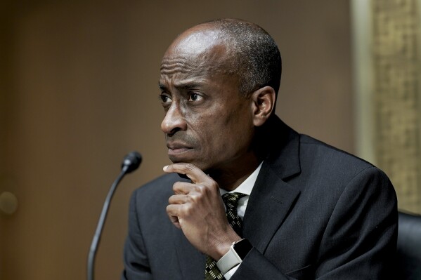 FILE - Philip Jefferson, then-nominee to be a member of the Federal Reserve Board of Governors, listens during a Senate Banking, Housing and Urban Affairs Committee confirmation hearing on Feb. 3, 2022, in Washington. Jefferson, now Federal Reserve Vice Chair, suggested Tuesday, April 16, 2024, that the central bank's key rate may have to remain at its peak for a while to bring down persistently elevated inflation. (Ken Cedeno/Pool via AP, File)