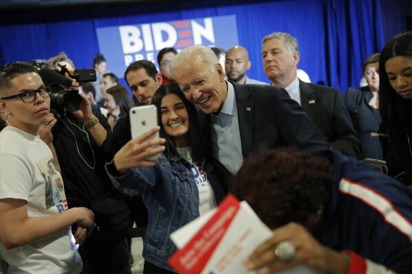 FILE - In this Nov. 16, 2019, file photo, Democratic presidential candidate former Vice President Joe Biden poses for a selfie at a campaign event in Las Vegas. (AP Photo/John Locher, File)