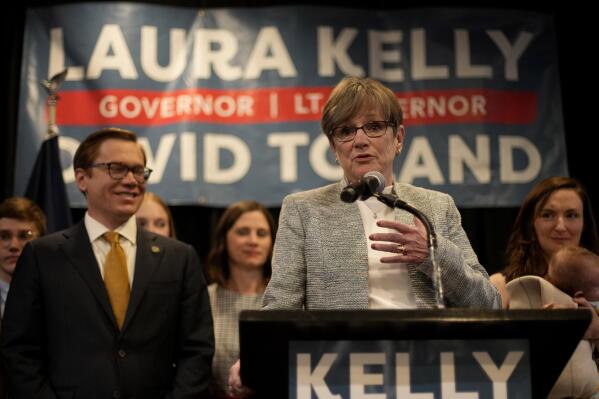 Kansas Gov. Laura Kelly speaks to supporters at a watch party after calling it a night with the race too close to call, Wednesday, Nov. 9, 2022, in Topeka, Kan. Kelly was facing Republican challenger and Kansas Attorney General Derek Schmidt. (AP Photo/Charlie Riedel)
