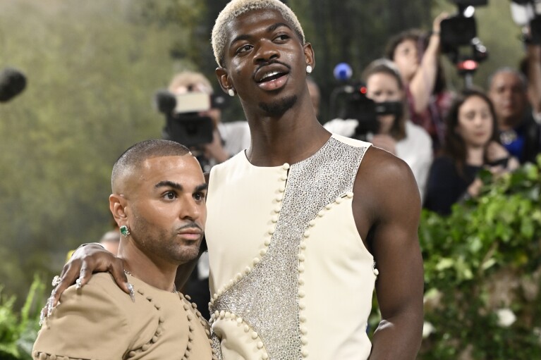 Raul Lopez, left, and Lil Nas X attend The Metropolitan Museum of Art's Costume Institute benefit gala celebrating the opening of the "Sleeping Beauties: Reawakening Fashion" exhibition on Monday, May 6, 2024, in New York. (Photo by Evan Agostini/Invision/AP)
