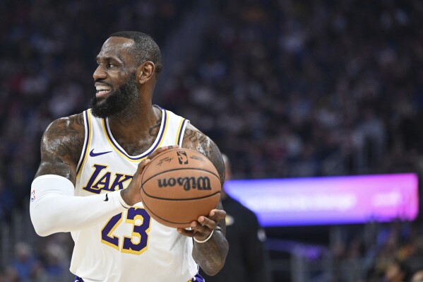 Los Angeles Lakers forward LeBron James smiles during the first half of an NBA basketball game against the Golden State Warriors, Saturday, Jan. 27, 2024, in San Francisco. (AP Photo/Nic Coury)