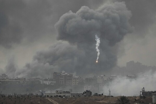 Smoke rises following an Israeli airstrike in the Gaza Strip, as seen from southern Israel, Wednesday, Nov. 22, 2023. (AP Photo/Leo Correa)